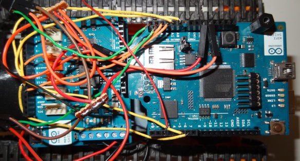 Arduino Uno stacked with wifi shield and connected to motor shield